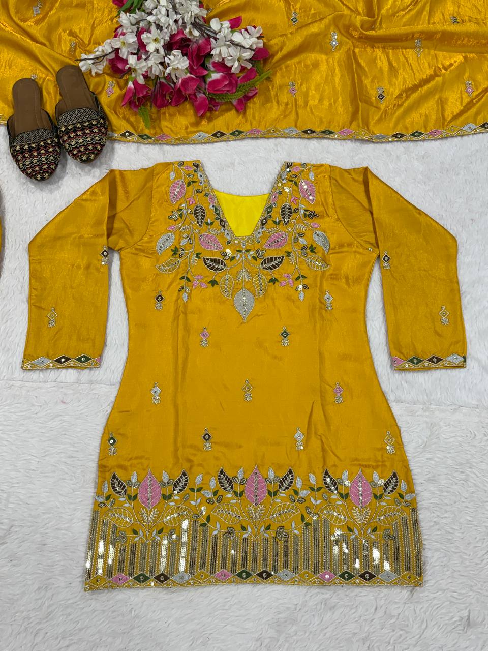 Elegant Rust Orange Silk Kurta and Flared Palazzo Set Adorned with Intricate Multicolored Botanical Embroidery and Mirror Work